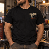 Clocked Out funny blue collar black T-shirt worn in a workshop
