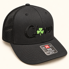 Clover hat 3 black Richardson 112 black embroidered lettering with small green clover
