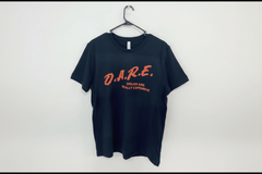 Navy blue t-shirt with red text 'D.A.R.E. Drugs Are Really Expensive' on a white background