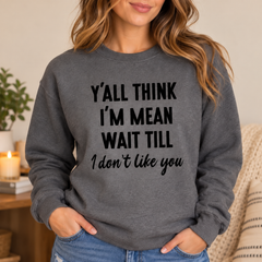 Woman wearing Y'all Think I'm Mean funny charcoal sweatshirt
